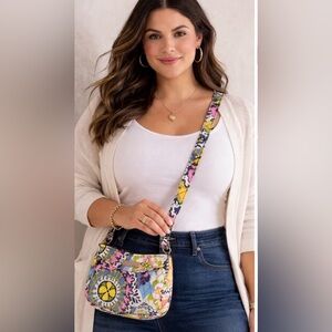 Vera Bradley Crossbody Bag with earrings and a pen